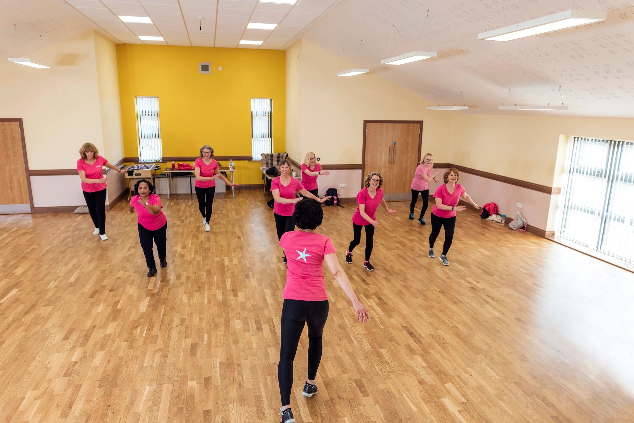 Instructor demonstrating Zumba moves in class
