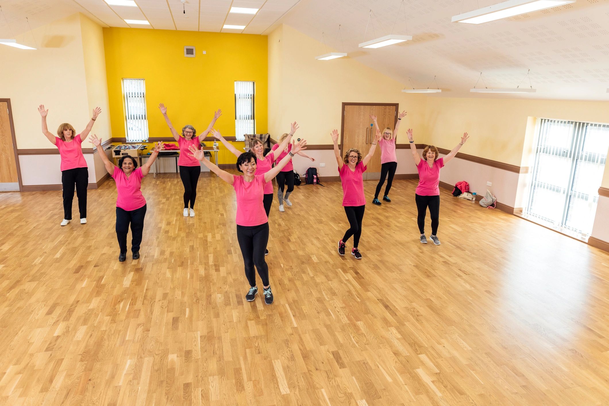 Participants dancing together in a Zumba class